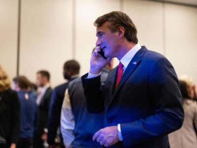 Glenn Youngkin speaks on the phone as he watches results come in on election night at the Westfields Marriott Washington Dulles on November 2, 2021, in Chantilly, Virginia.