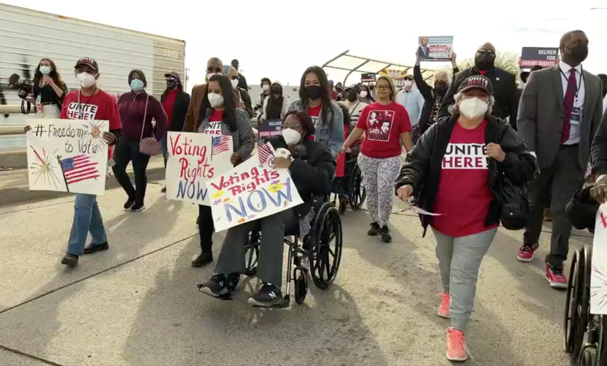 Voting rights advocates march in Phoenix, Arizona, on January 15, 2022.