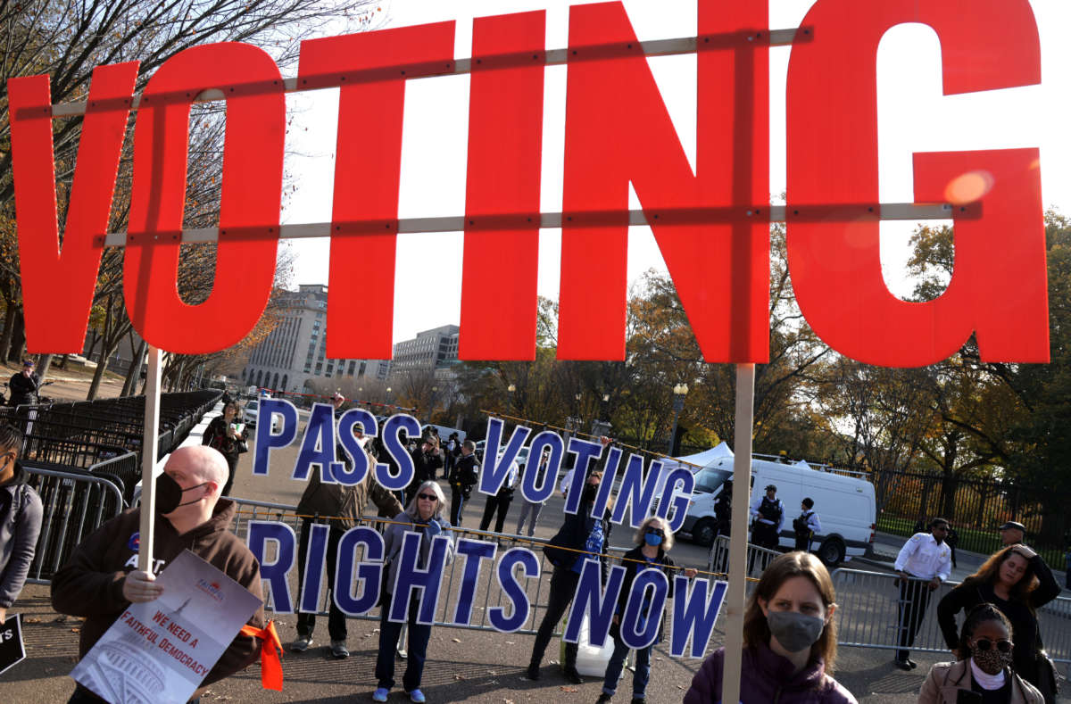 Activists take part in a voting rights protest in front of the White House on November 17, 2021, in Washington, D.C.