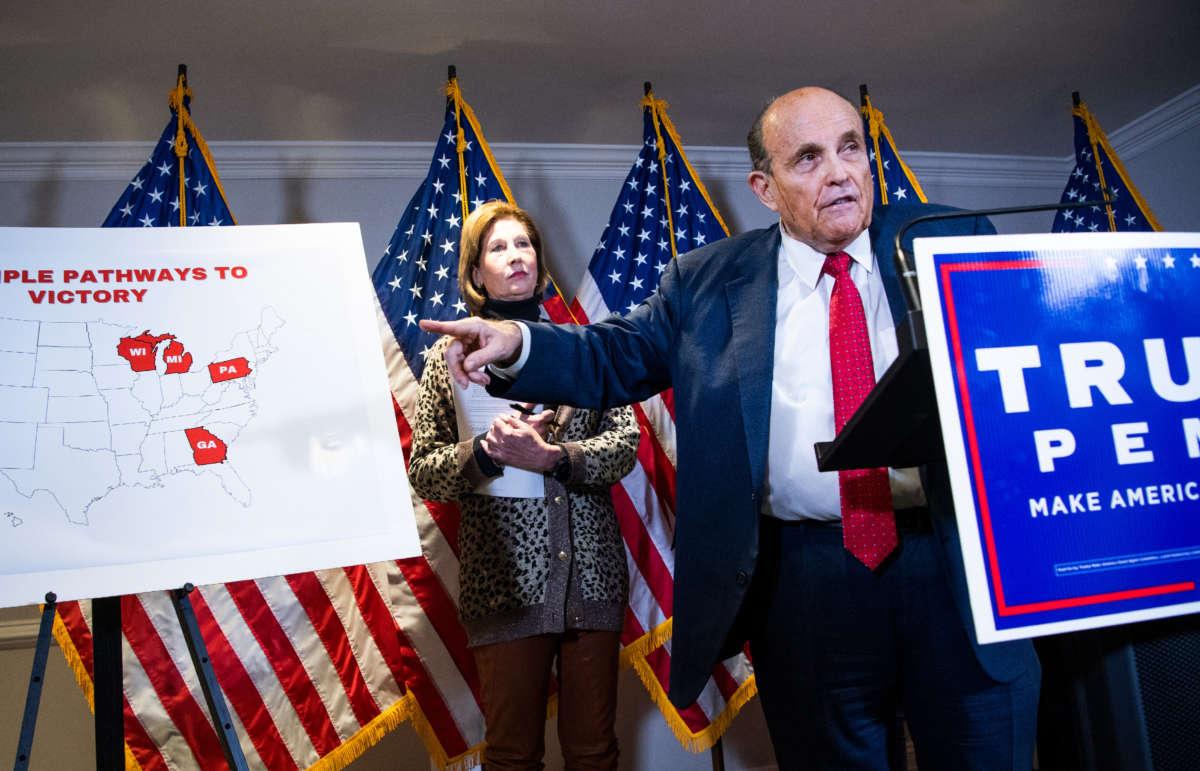Rudolph Giuliani, attorney for President Donald Trump, conducts a news conference along with Sidney Powell at the Republican National Committee on lawsuits regarding the outcome of the 2020 presidential election on November 19, 2020.