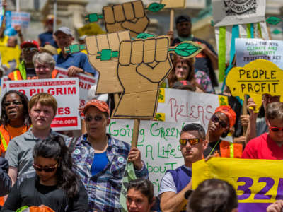 Hundreds of New Yorkers meet at the state capitol to call on Gov. Andrew Cuomo and state lawmakers to support the NYS Climate & Community Protection Act on June 1, 2016, in Albany, New York.