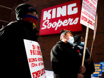 King Soopers grocery store workers walk the picket line as they strike at more than 70 stores across the Denver metro area on January 12, 2022, in Denver, Colorado.