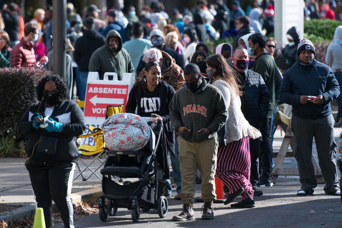 People wait in line to participate in early voting on October 31, 2020, in Greenville, South Carolina.