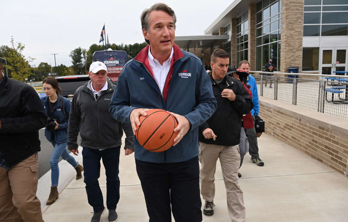 Republican gubernatorial candidate Glenn Youngkin heads to shoot baskets as he makes a stop at Rocky Run Middle School on November 2, 2021, in Chantilly, Virginia.