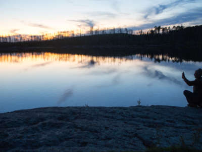 An outdoor enthusiast takes a picture by one of the hundreds of fresh water lakes that make up the Boundary Waters in September of 2019 in the northern woods of Minnesota.