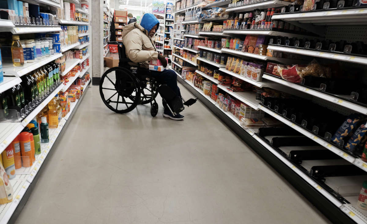 People shop for groceries in a Manhattan store on January 12, 2022, in New York City.