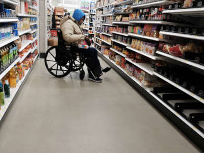 People shop for groceries in a Manhattan store on January 12, 2022, in New York City.