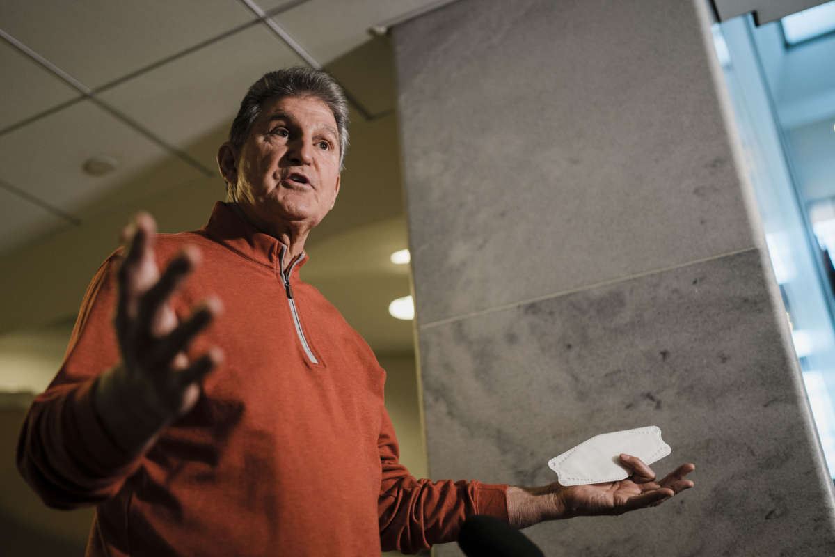 Sen. Joe Manchin speaks during a press availability ahead of a Senate democratic caucus meeting on voting rights and the filibuster on Capitol Hill on January 18, 2022 in Washington, D.C.