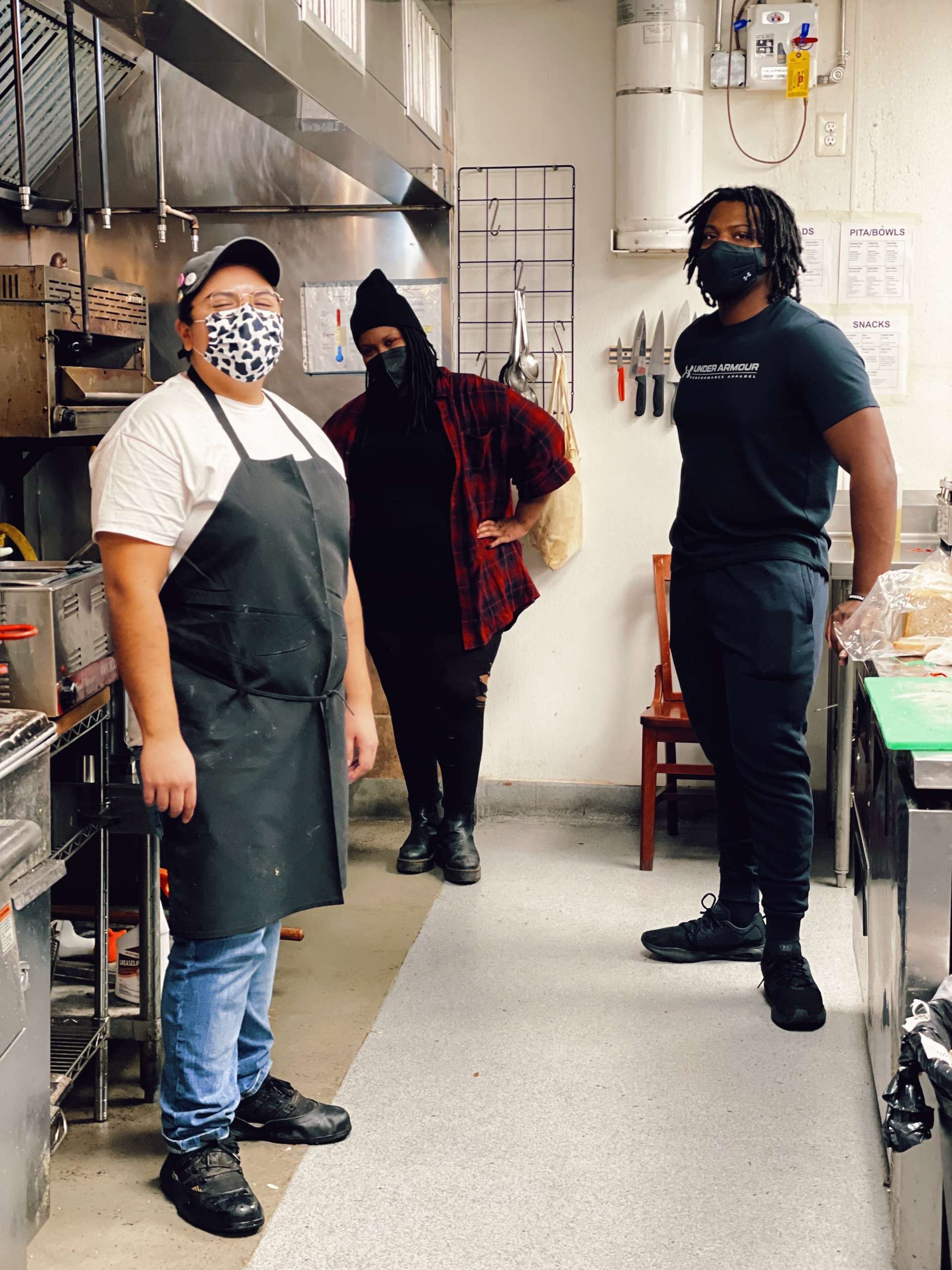 Worker members on break in Red Emma’s kitchen (Left to Right: Pam Montanez, Najee Haynes-Follins, and Malik Cole).