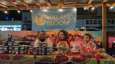 The children of participants in Oakland Bloom's incubator program at a neighborhood Small Business Saturday event selling items prepared by the chefs in December 2021.