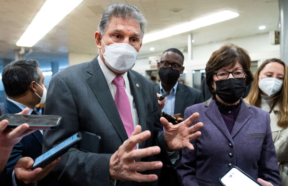 Senators Joe Manchin and Susan Collins talk with reporters about voting rights on January 20, 2022, inside the U.S. Capitol.