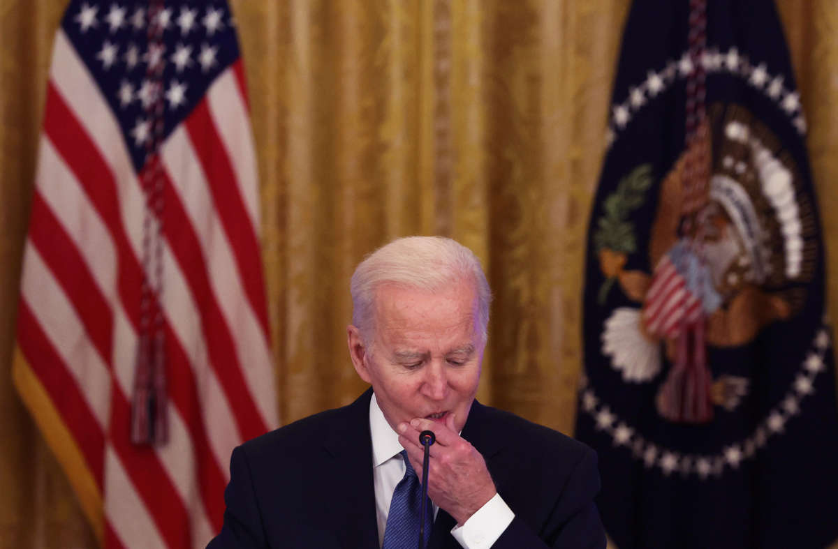 Joe Biden squeezes his lower lip