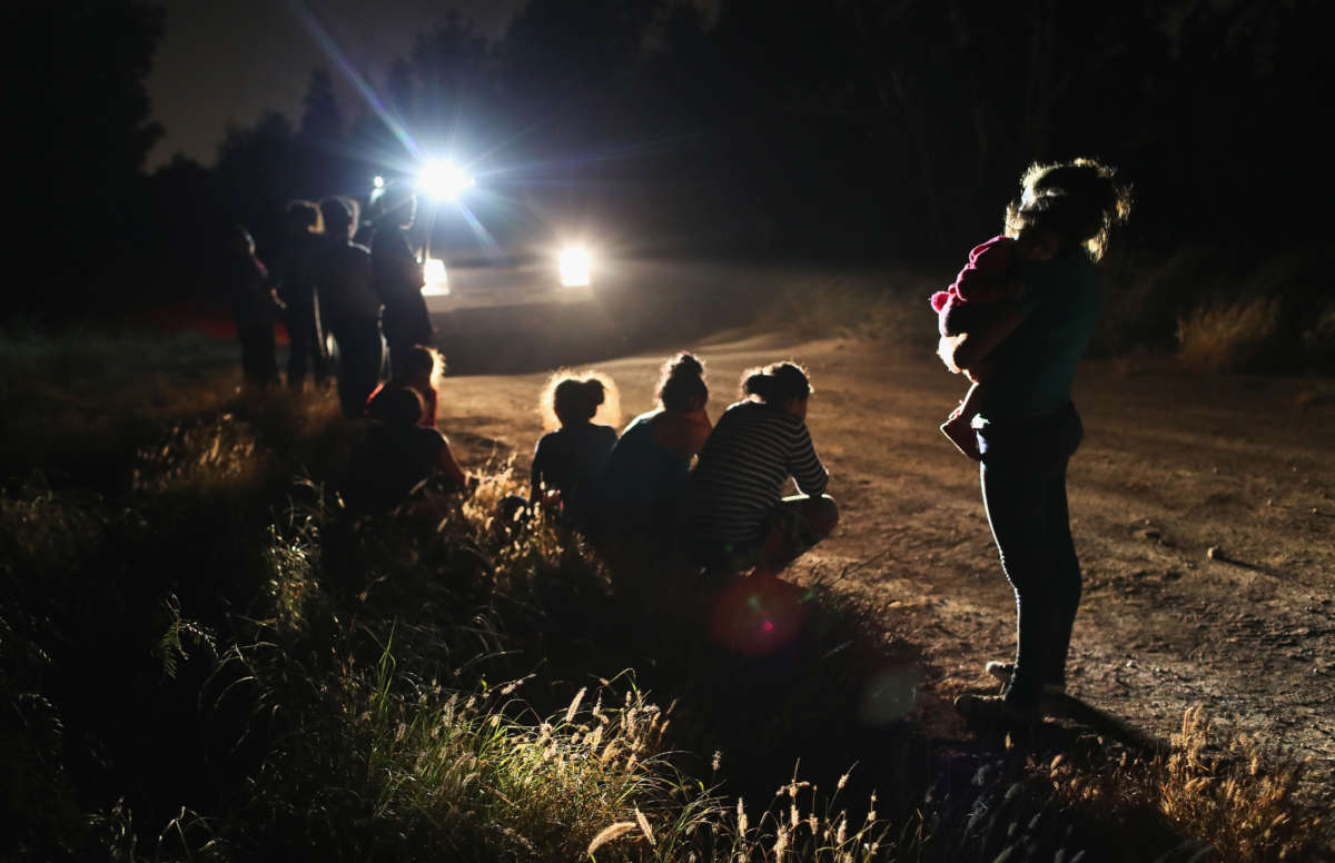 U.S. Border Patrol agents arrive to detain a group of Central American asylum seekers near the U.S.-Mexico border on June 12, 2018, in McAllen, Texas.