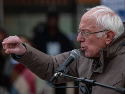 Sen. Bernie Sanders gestures as he speaks to striking Kellogg's workers in downtown Battle Creek, Michigan, on December 17, 2021.
