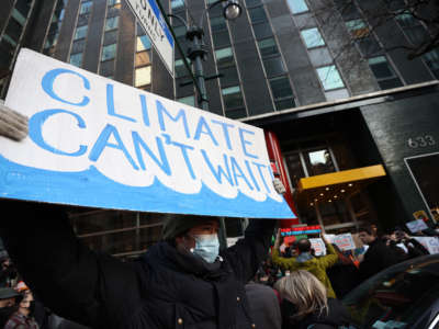 Climate crisis protesters gather outside the New York governor's office in New York City on January 25, 2022.