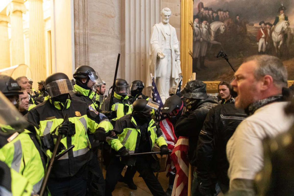 Police intervene against Trump supporters who breached security and entered the Capitol building in Washington, D.C., on January 6, 2021.