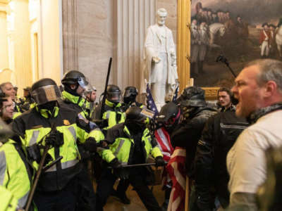 Police intervene against Trump supporters who breached security and entered the Capitol building in Washington, D.C., on January 6, 2021.