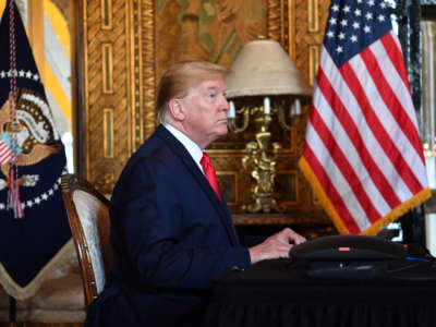 President Donald Trump makes a video call to the troops stationed worldwide at the Mar-a-Lago estate in Palm Beach, Florida, on December 24, 2019.