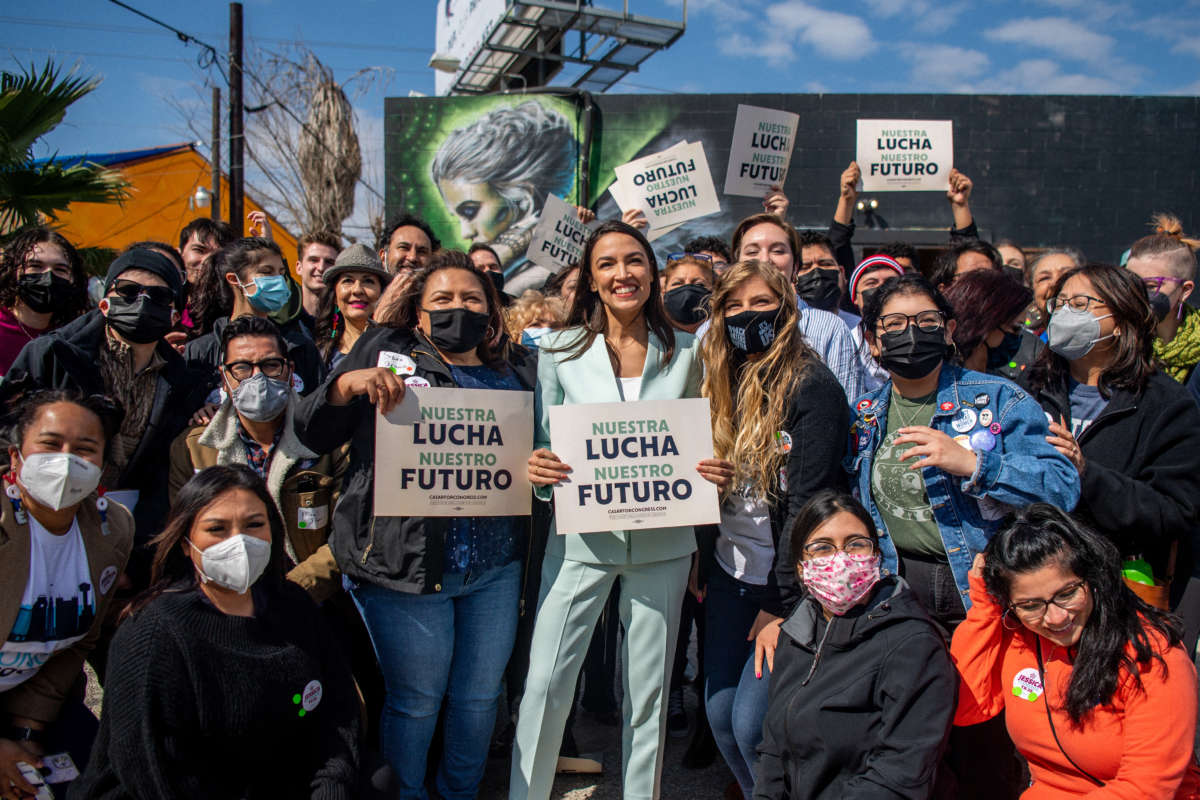 Rep. Alexandria Ocasio-Cortez poses for pictures with supporters during the 'Get Out the Vote' rally on February 12, 2022, in San Antonio, Texas.