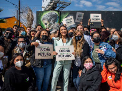 Rep. Alexandria Ocasio-Cortez poses for pictures with supporters during the 'Get Out the Vote' rally on February 12, 2022, in San Antonio, Texas.