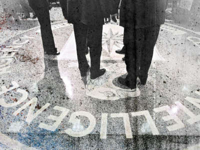 People stand on the seal of the Central Intelligence Agency on March 20, 2001