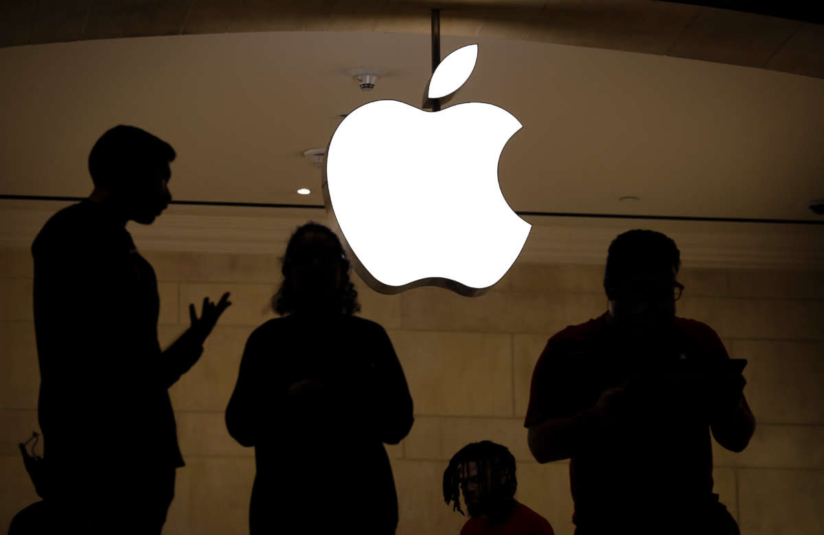 Employees stand in an Apple retail store in Grand Central Terminal, January 3, 2019, in New York City.