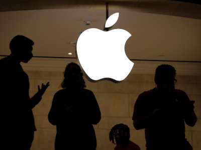 Employees stand in an Apple retail store in Grand Central Terminal, January 3, 2019, in New York City.