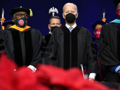 From left, Rep. Jim Clyburn, President Joe Biden and Interim South Carolina State University President Alexander Conyers arrive for the university's graduation ceremony in Orangeburg, South Carolina, on December 17, 2021.