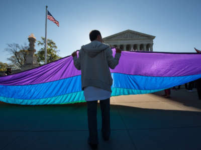 Demonstrators in favor of and opposed to same-sex marriage rally outside the Supreme Court in Washington, D.C., on April 28, 2015.