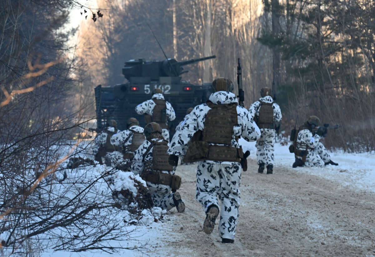 Servicemen take part in joint tactical and special exercises of the Ukrainian Ministry of Internal Affairs, the Ukrainian National Guard and Ministry Emergency in a ghost city of Pripyat, near Chernobyl Nuclear Power Plant on February 4, 2022.