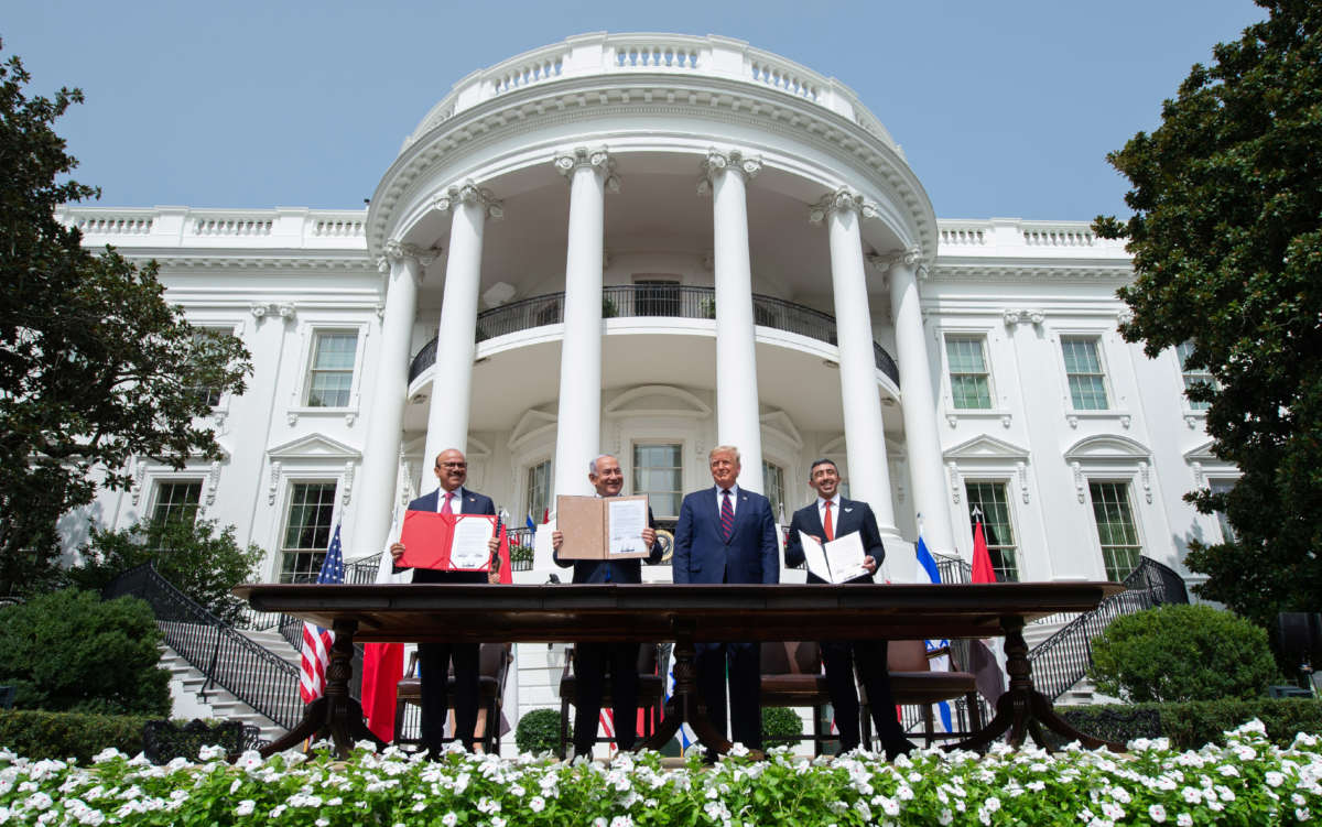 From left, Bahrain Foreign Minister Abdullatif al-Zayani, Israeli Prime Minister Benjamin Netanyahu, President Donald Trump, and UAE Foreign Minister Abdullah bin Zayed Al-Nahyan hold up documents after participating in the signing of the Abraham Accords at the White House in Washington, D.C., on September 15, 2020.