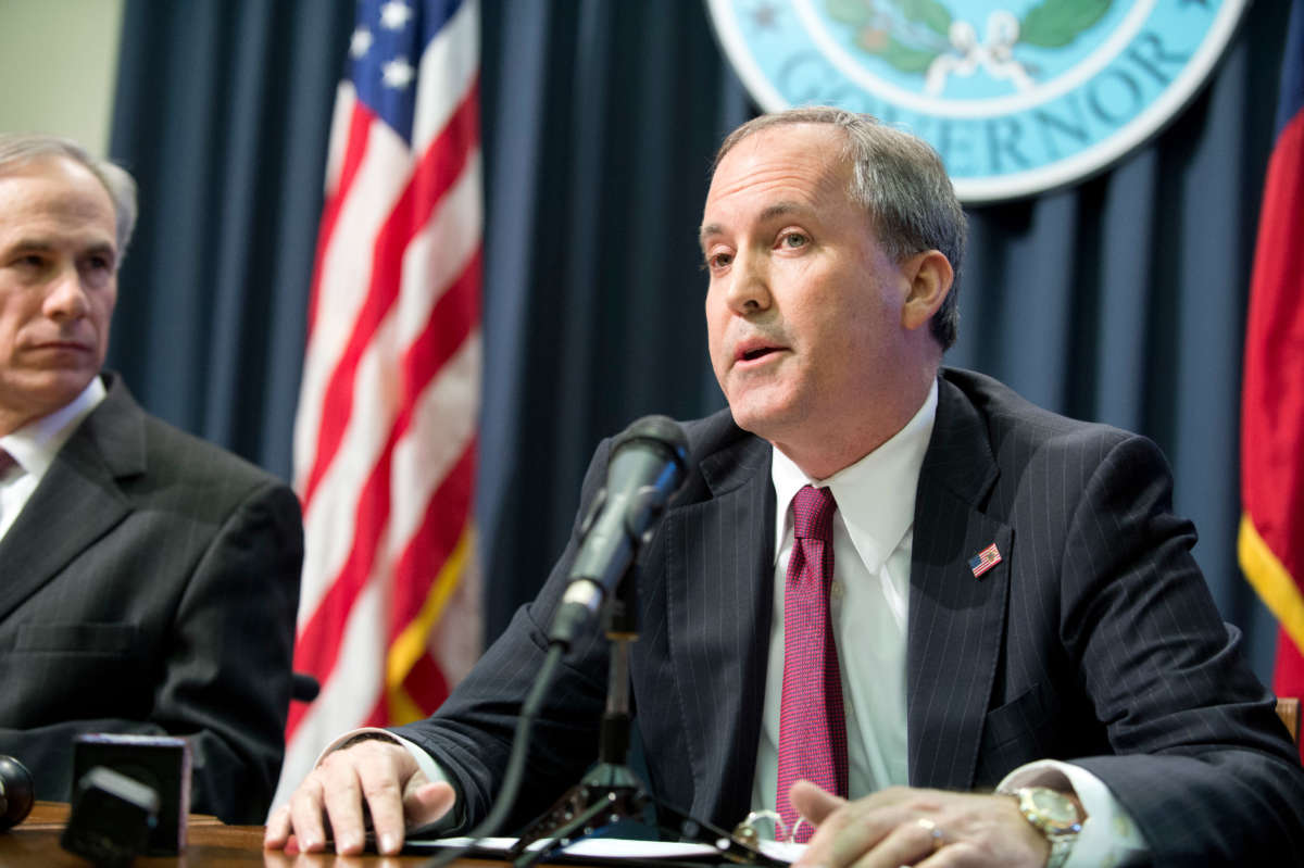 Texas Attorney General Ken Paxton holds a joint press conference on February 18, 2015, with Texas Gov. Greg Abbott.
