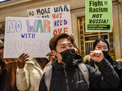 People participate in a protest in Grand Central Station in the borough of Manhattan against war in Ukraine on February 19, 2022, in New York City.