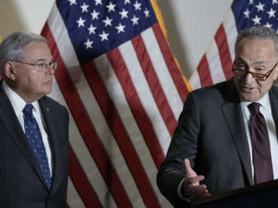 Sen. Bob Menendez and Senate Majority Leader Chuck Schumer speak to reporters during a news conference on May 18, 2021, in Washington, D.C.