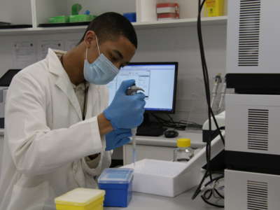 Researcher Emile Hendricks works in Afrigen's analytical laboratory in Cape Town, South African, on December 10, 2021.