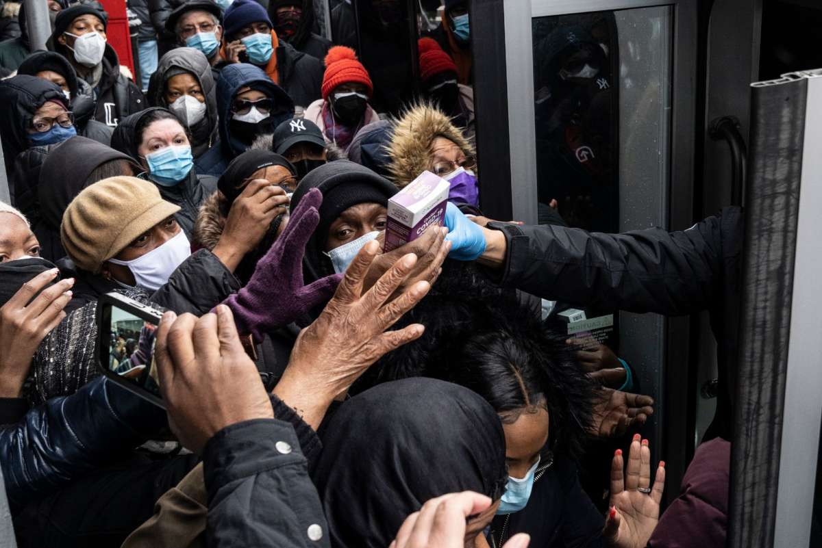 A crowd of people in NYC scramble for free COVID tests