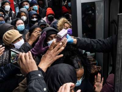 A crowd of people in NYC scramble for free COVID tests