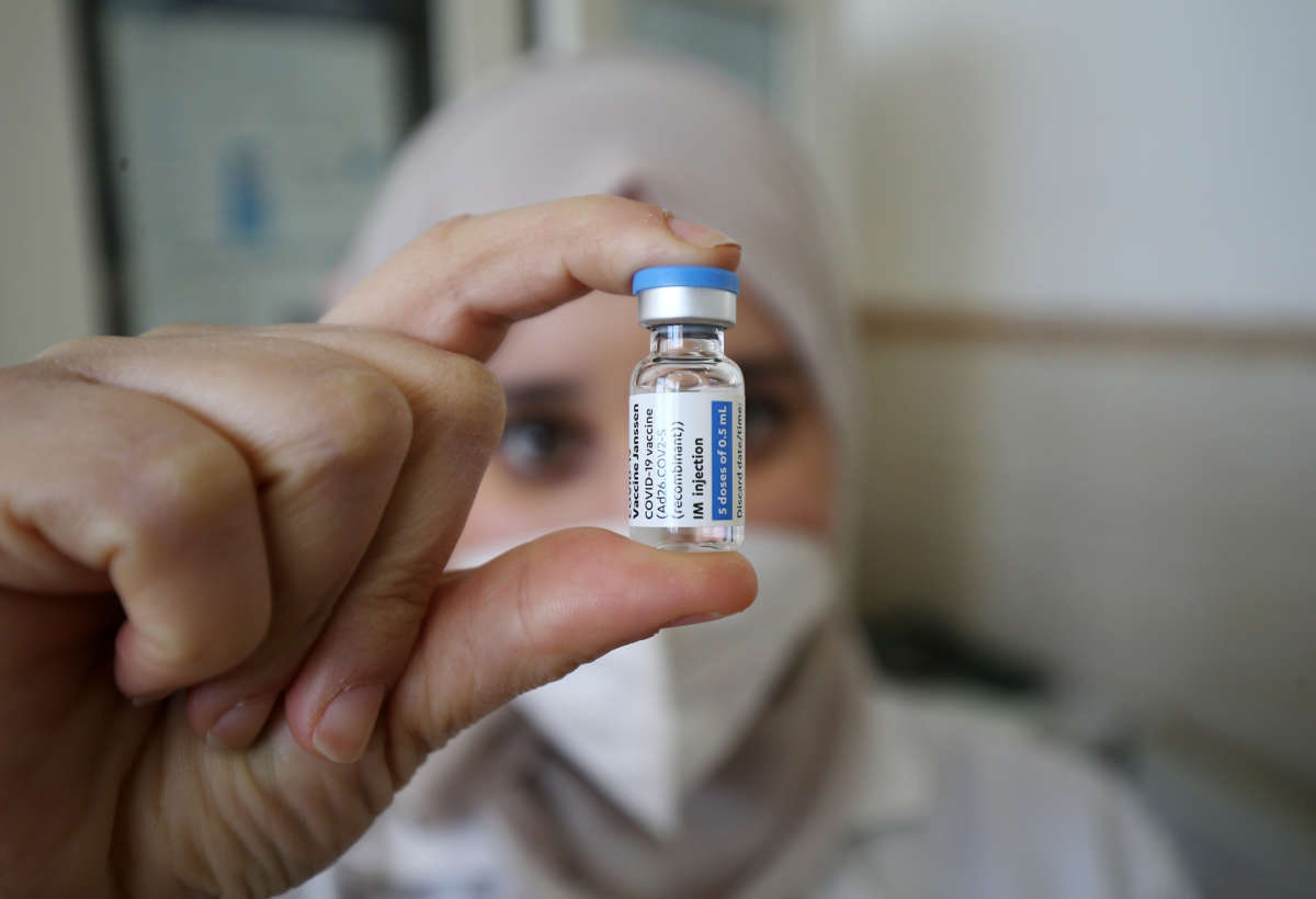 A medical worker prepares a dose of COVID-19 vaccine in Algiers, Algeria, on January 17, 2022.