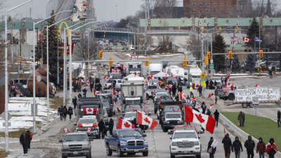 Protestors and supporters set up at a blockade at the foot of the Ambassador Bridge, sealing off the flow of commercial traffic over the bridge into Canada from Detroit, on February 10, 2022, in Windsor, Canada.