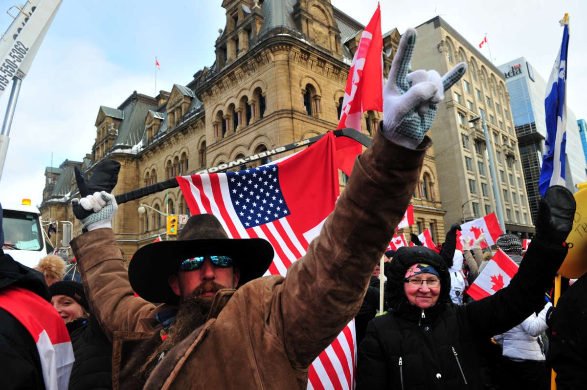 Supporters and truckers front the Parliament Hill during a protest in downtown of Ottawa, Canada, on February 12, 2022.