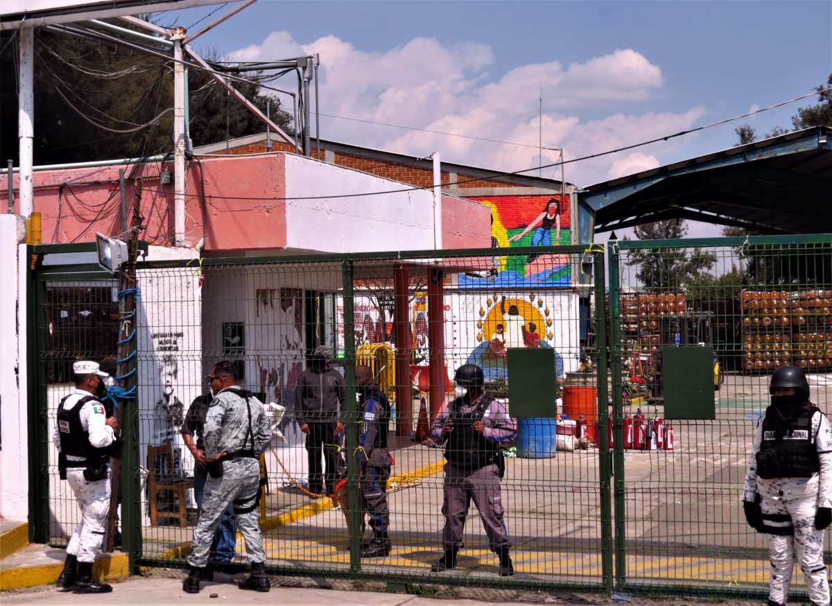 The Mexican National Guard and other security forces guard the entrance to the plant that had been run by Indigenous people on February 15, 2022, in Puebla, Mexico.