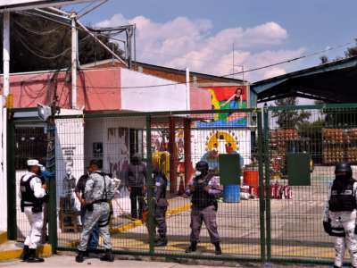 The Mexican National Guard and other security forces guard the entrance to the plant that had been run by Indigenous people on February 15, 2022, in Puebla, Mexico.