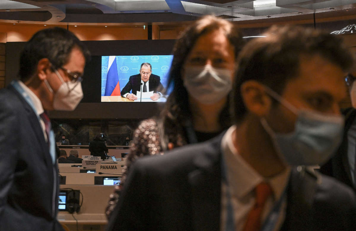 Ambassadors and diplomats walkout while Russia's Foreign Minister Sergey Lavrov addresses the Conference on Disarmament in Geneva with a prerecorded video message on March 1, 2022.