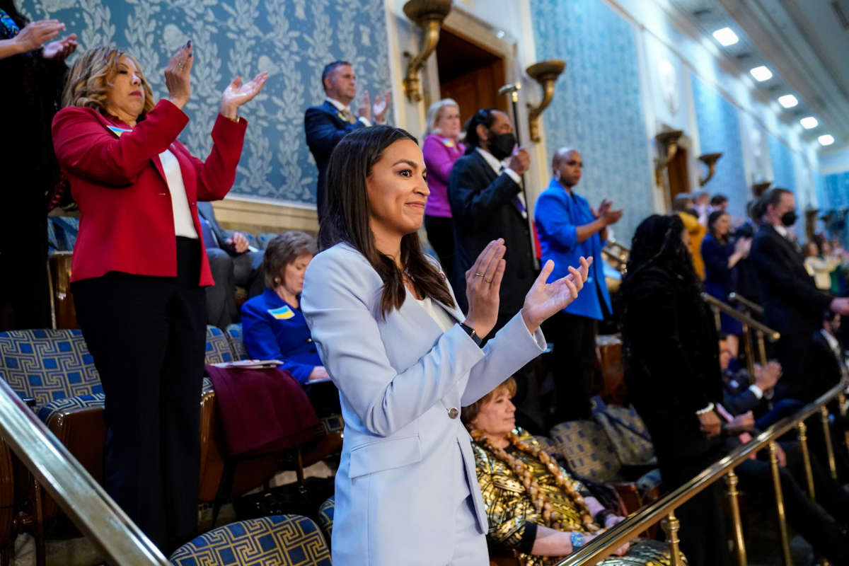 Rep. Alexandria Ocasio-Cortez claps in the U.S. Capitol’s House Chamber on March 1, 2022, in Washington, D.C.