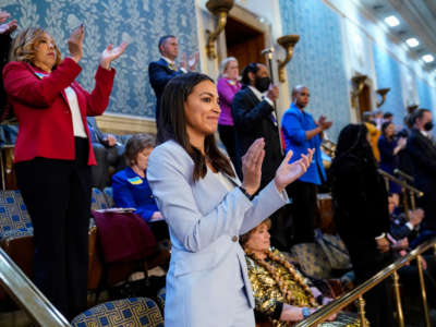 Rep. Alexandria Ocasio-Cortez claps in the U.S. Capitol’s House Chamber on March 1, 2022, in Washington, D.C.