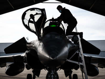 A Rafale fighter jet pilot inspects his aircraft prior to taking off for a daily NATO border watch mission sortie over Poland, at the Mont-de-Marsan airbase in southwestern France, on March 1, 2022.