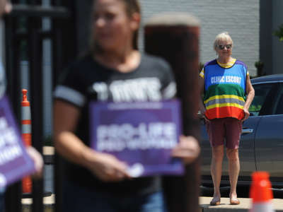 A Planned Parenthood clinic escort is seen during an anti-abortion rally outside the Planned Parenthood Reproductive Health Center on June 4, 2019, in St Louis, Missouri.