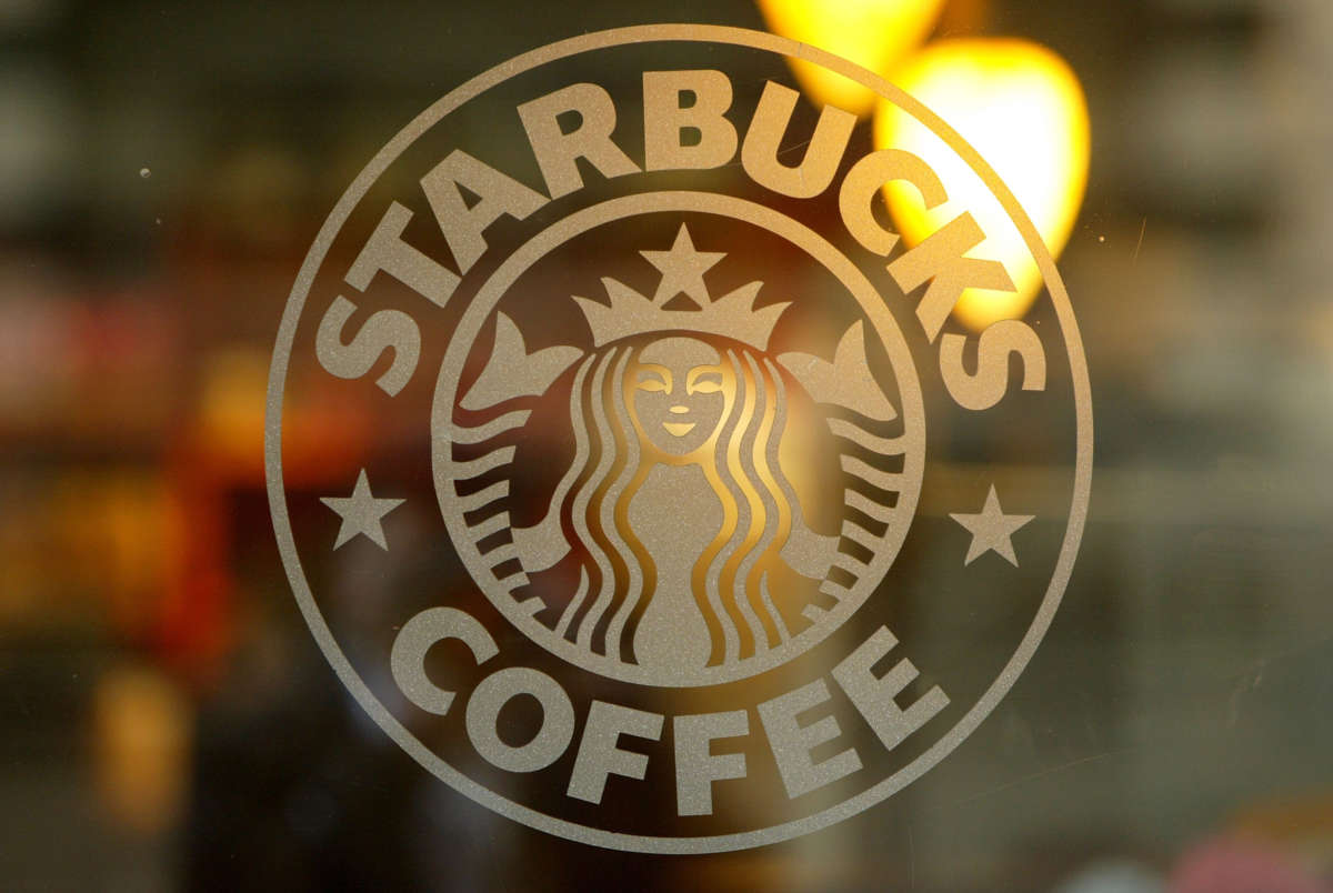 A logo is seen on the glass storefront door of a Starbucks coffee shop in San Francisco, California.