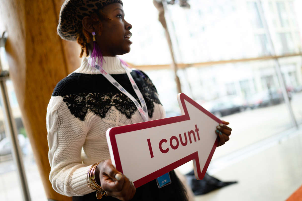 A census employee holds a sign reading I count at the unveiling of the U.S. Census Bureau's campaign for the 2020 United States Census at Arena Stage in Washington, D.C., on January 14, 2020.