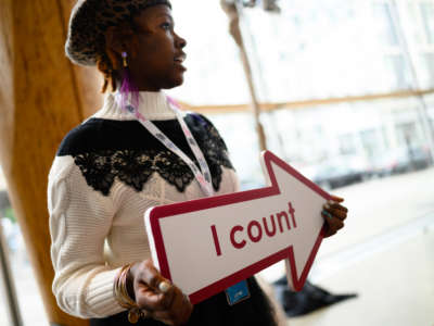 A census employee holds a sign reading I count at the unveiling of the U.S. Census Bureau's campaign for the 2020 United States Census at Arena Stage in Washington, D.C., on January 14, 2020.